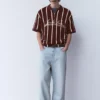 Gestreiftes Strick-Poloshirt mit Reißverschluss