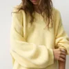Oversize-Pullover mit asymmetrischem Saum Oversize-Pullover mit asymmetrischem Saum
