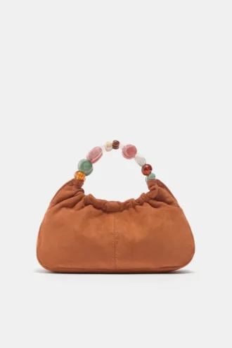 Perlenbesetzte Handtasche Perlenbesetzte Handtasche
