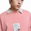 Sweatshirt mit rosa Label Sweatshirt mit rosa Label