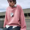 Sweatshirt mit rosa Label Sweatshirt mit rosa Label